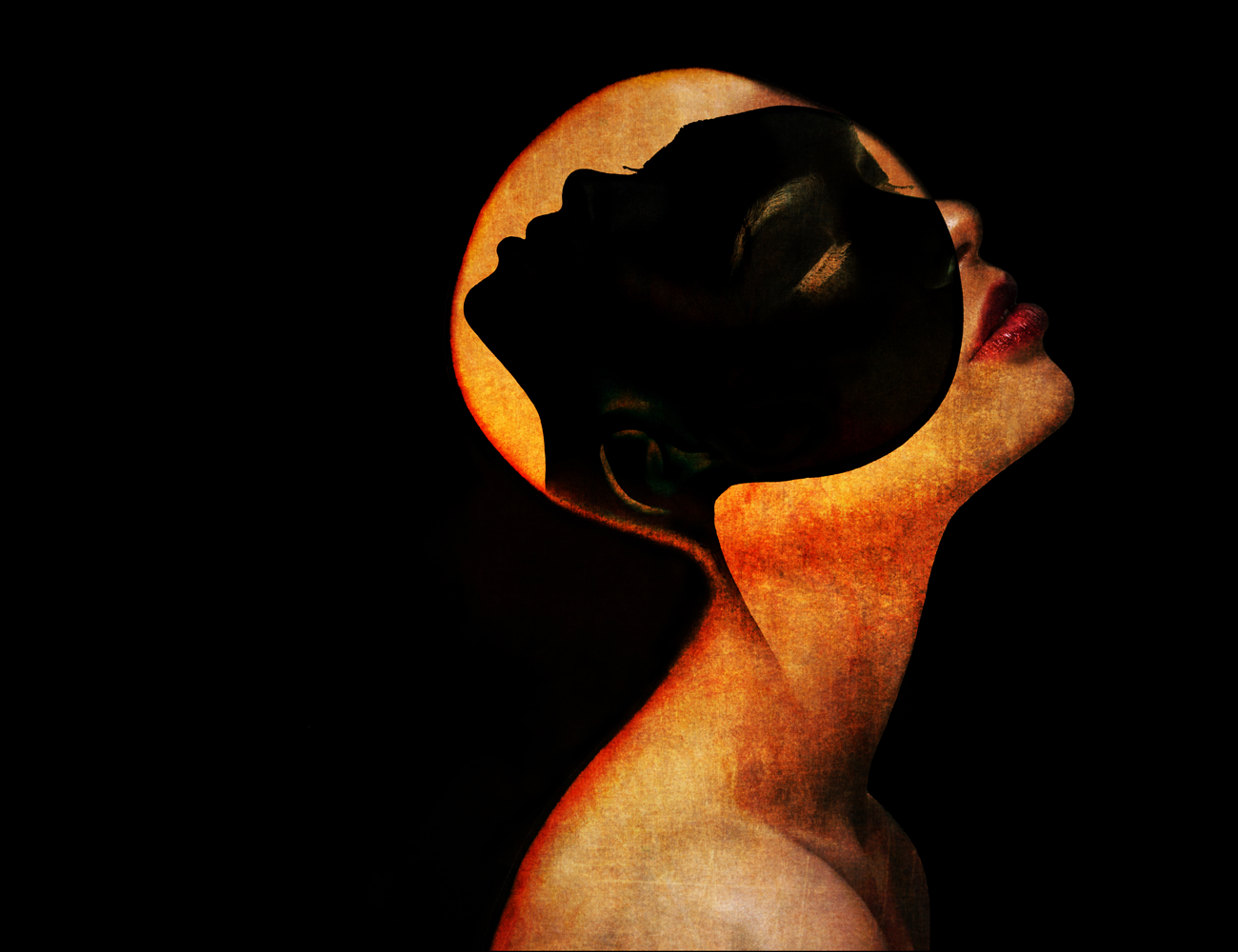 bald woman wearing a mask of a woman's silhouette 